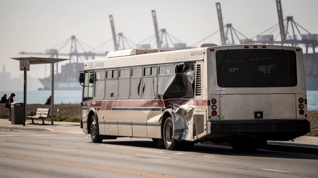 City bus with a damaged side panel in Long Beach