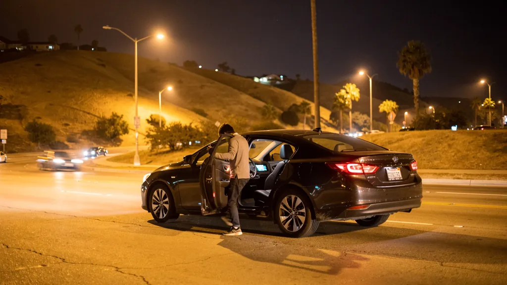 Passenger leaving a rideshare car at night in Santa Clarita